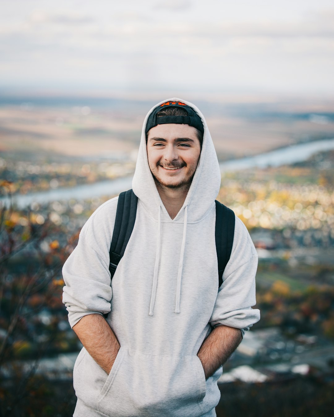Guy with a white hoodie smiling